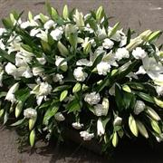 Large White Lilies and White Carnation Casket Spray