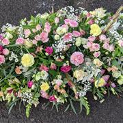 Pastel Colours Casket Spray Seasonal Flowers